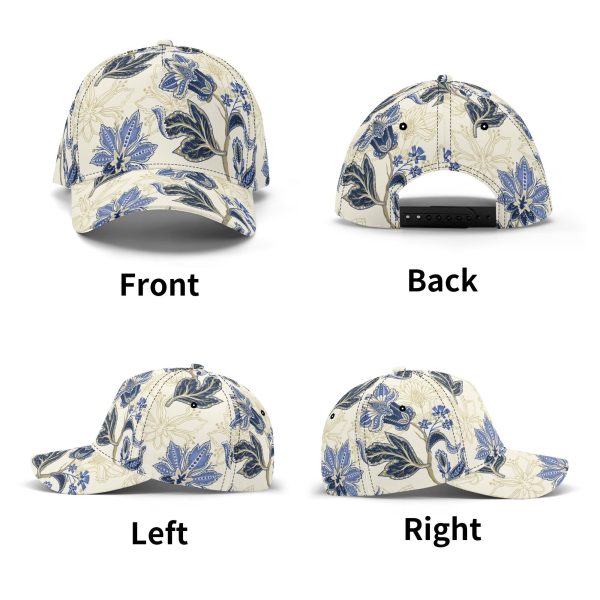 Gorra de béisbol con estampado floral vintage en azul y dorado, mostrando detalles de paisley y visera pre-curvada para protección solar.