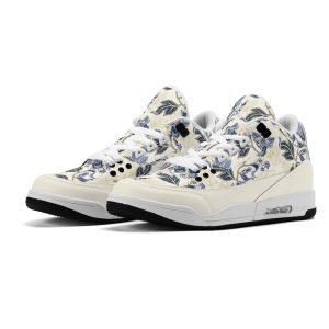 Zapatillas retro de baloncesto en color crudo con estampado floral vintage en azul y dorado, mostrando tobillo alto acolchado y suela antideslizante.