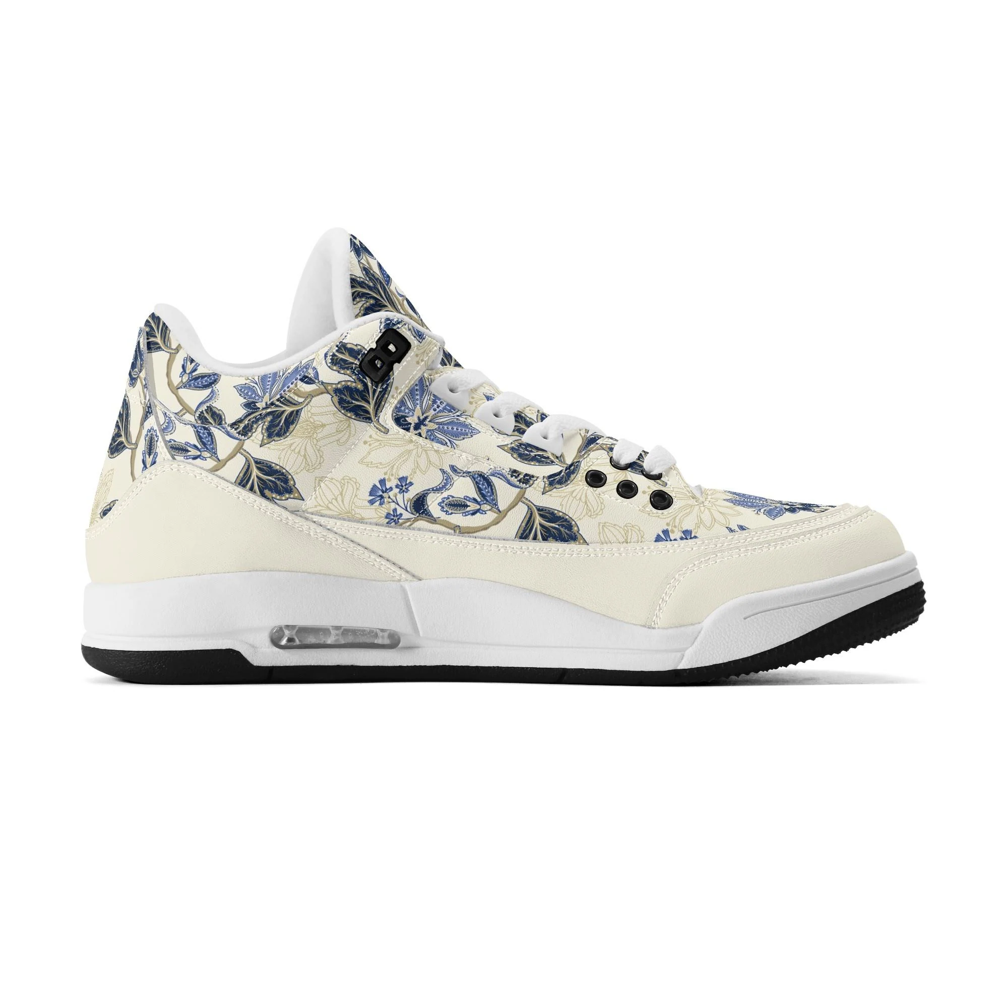 Zapatillas retro de baloncesto en color crudo con estampado floral vintage en azul y dorado, mostrando tobillo alto acolchado y suela antideslizante.