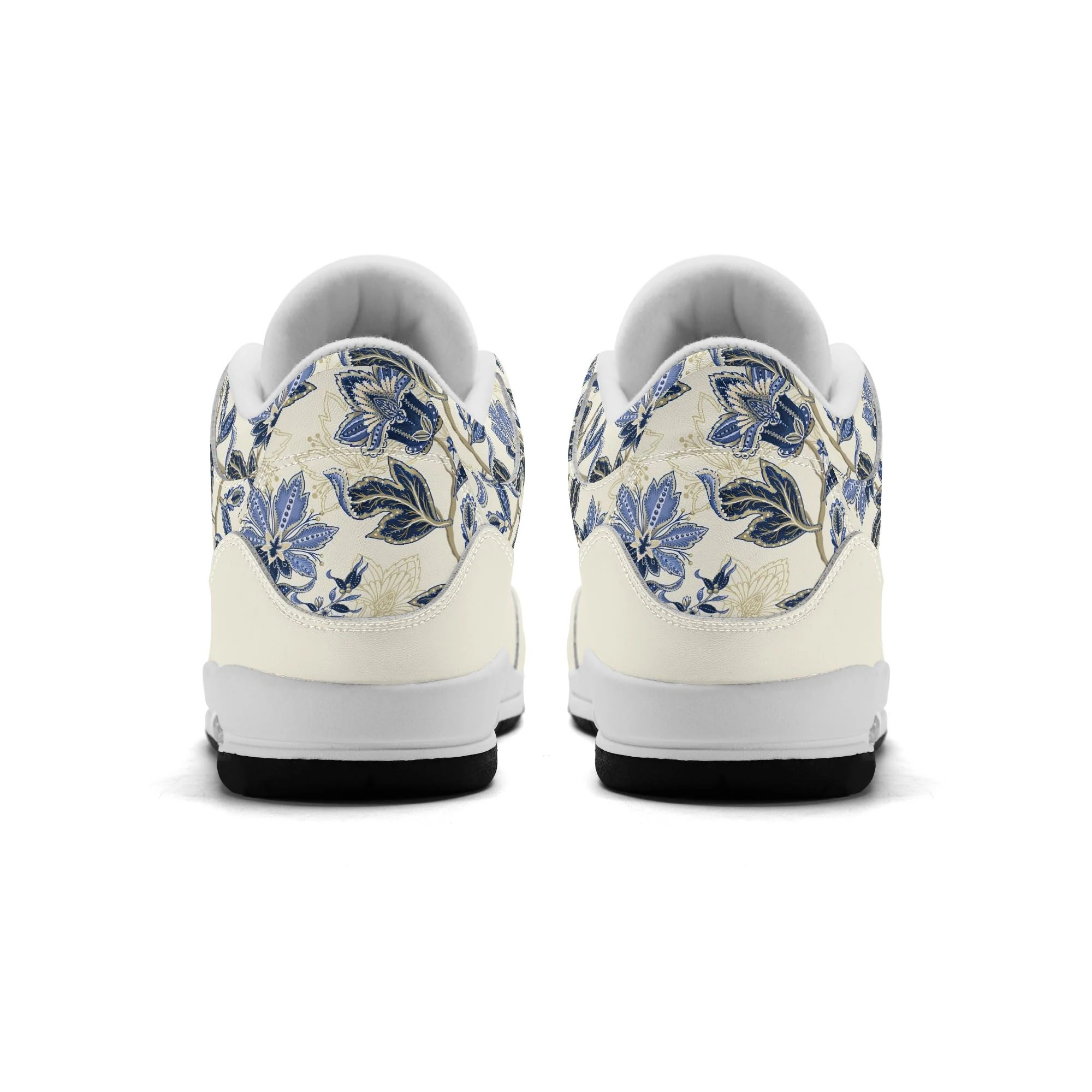 Zapatillas retro de baloncesto en color crudo con estampado floral vintage en azul y dorado, mostrando tobillo alto acolchado y suela antideslizante.