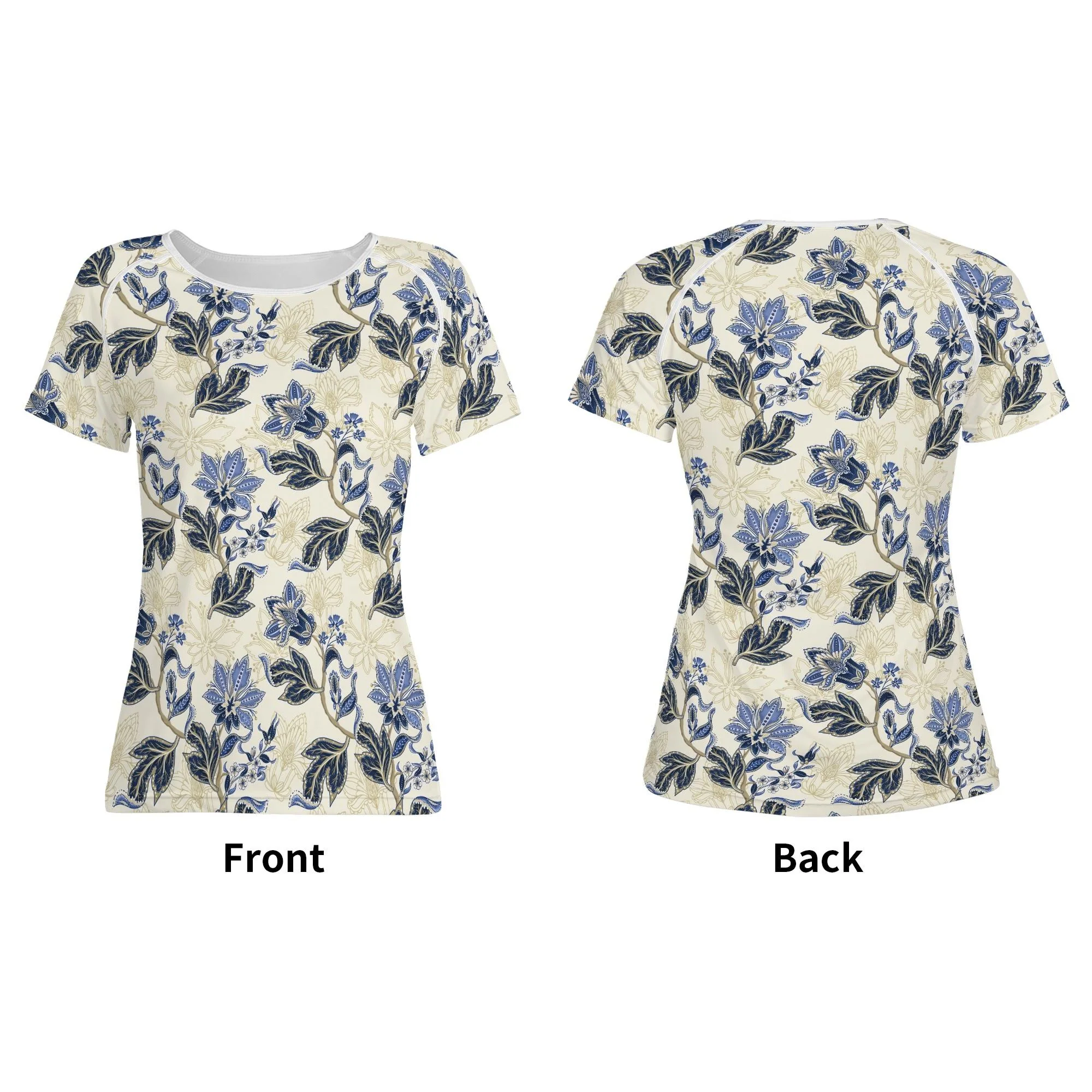 Camiseta de manga corta con estampado floral vintage en azul y dorado sobre fondo crema, mostrando costuras reforzadas y diseño único.