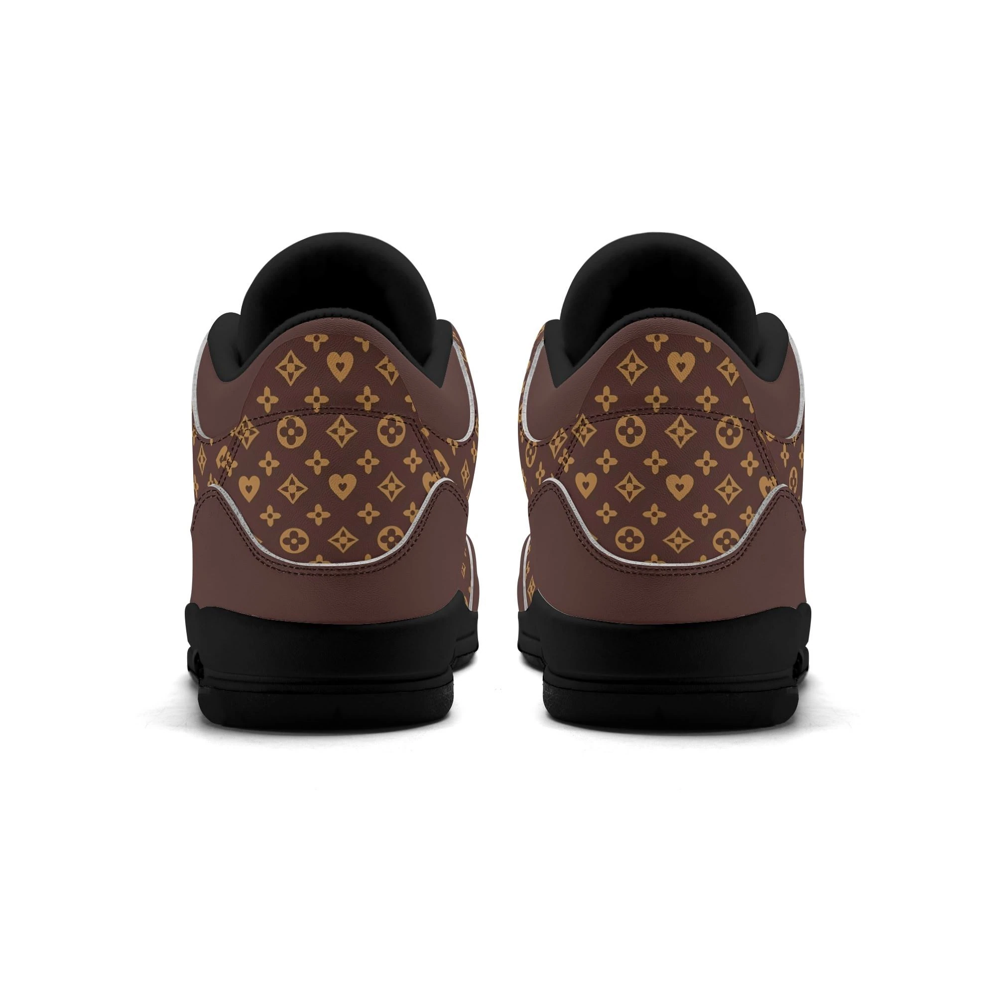 Zapatillas Monograma Luxe en vista lateral, mostrando su diseño elegante en marrón y dorado.