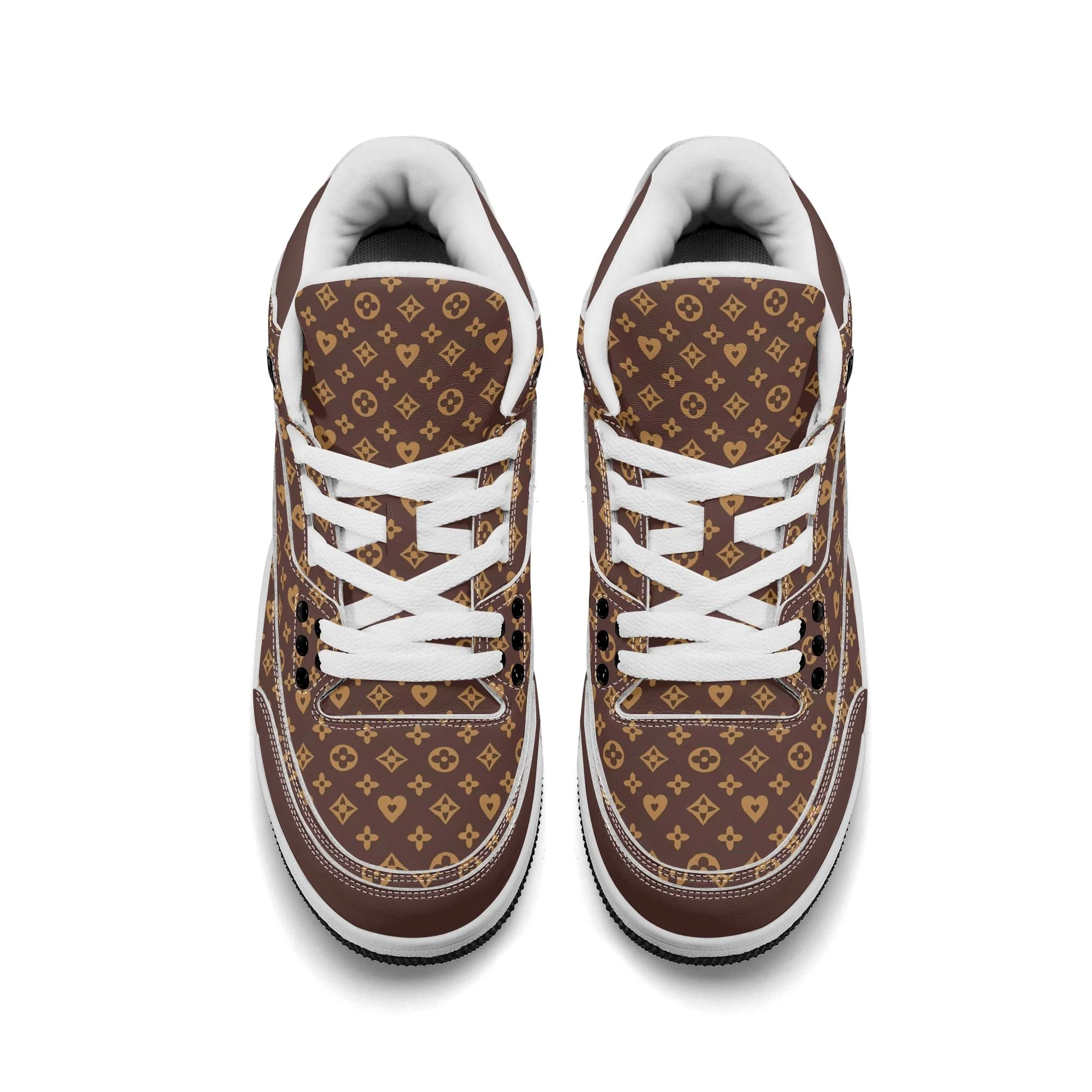 Zapatillas Monograma Luxe en vista lateral, mostrando su diseño elegante en marrón y dorado.