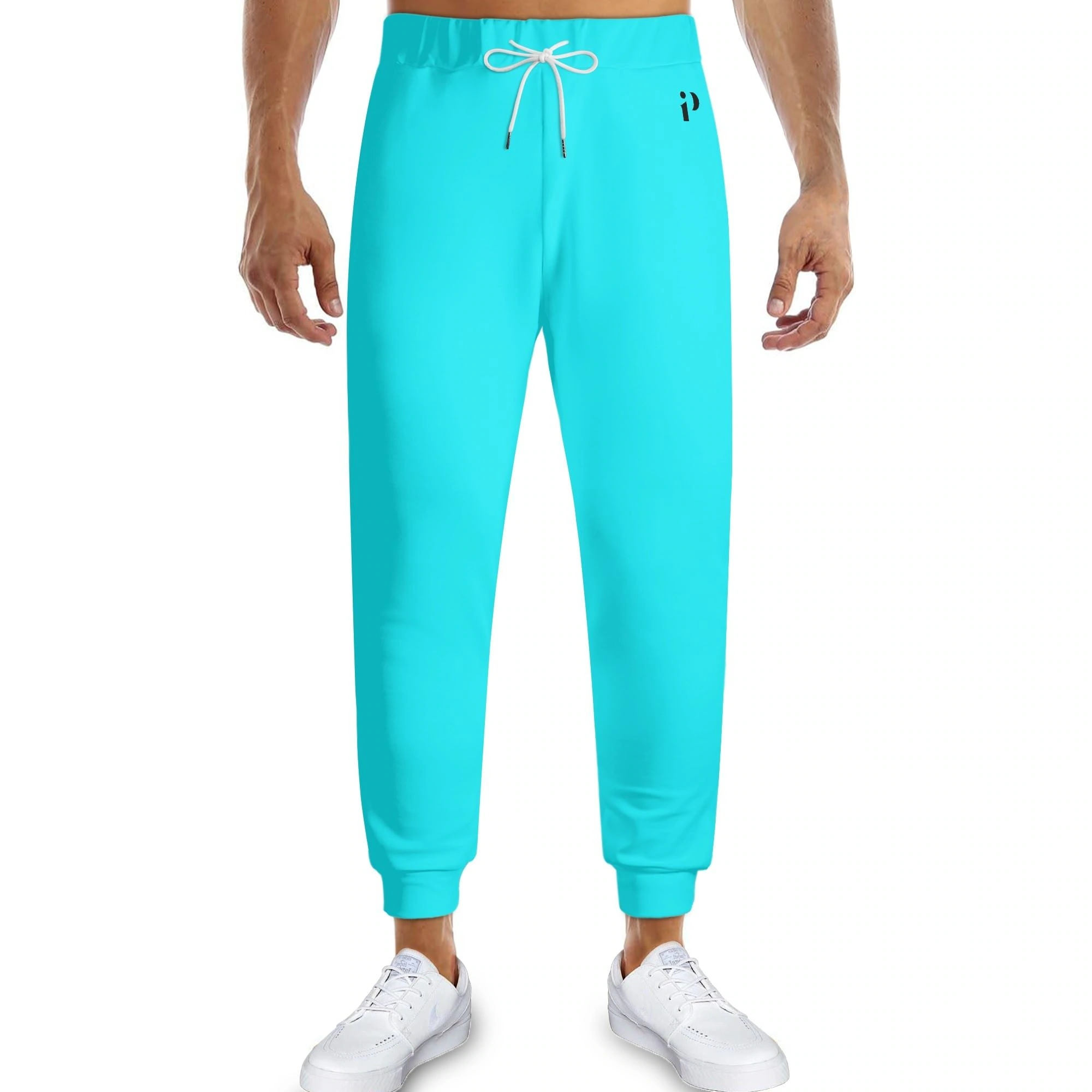Pantalón Deportivo Turquesa - Joggers unisex en azul turquesa vibrante con ajuste elástico y cordón ajustable. Ideal para un look moderno y cómodo.
