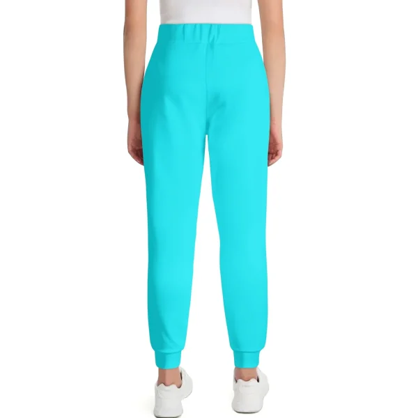 Pantalón Deportivo Turquesa - Joggers unisex en azul turquesa vibrante con ajuste elástico y cordón ajustable. Ideal para un look moderno y cómodo.
