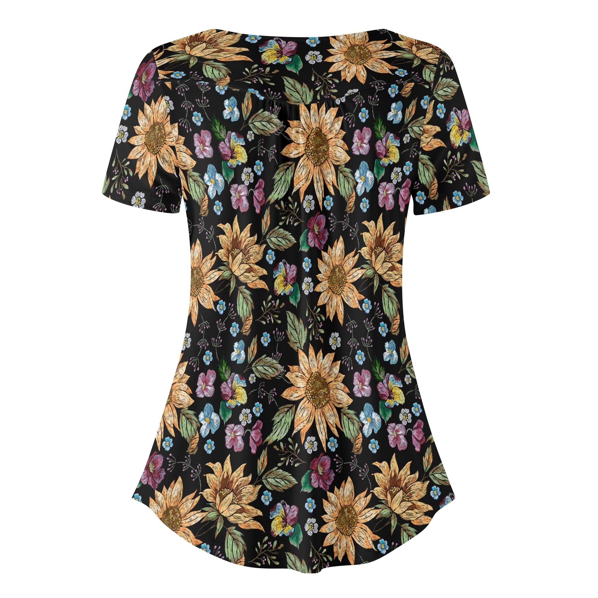 Detalle del diseño de la Blusa Floral Chic, mostrando los girasoles y flores en tonos vibrantes.