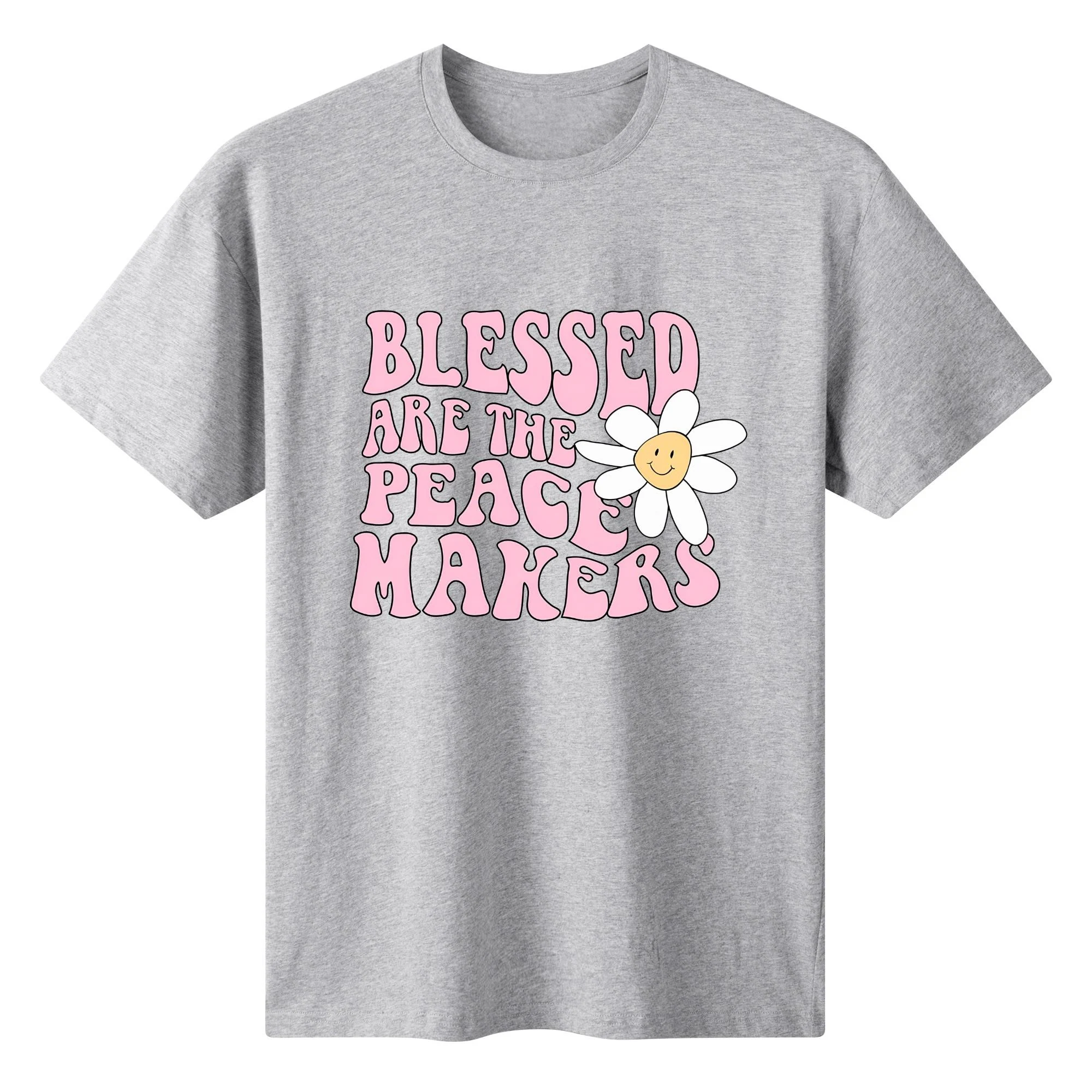 Camiseta rosa claro para mujer con estampado floral retro y frase "BLESSED ARE THE PEACE MAKERS" en tipografía años 70.