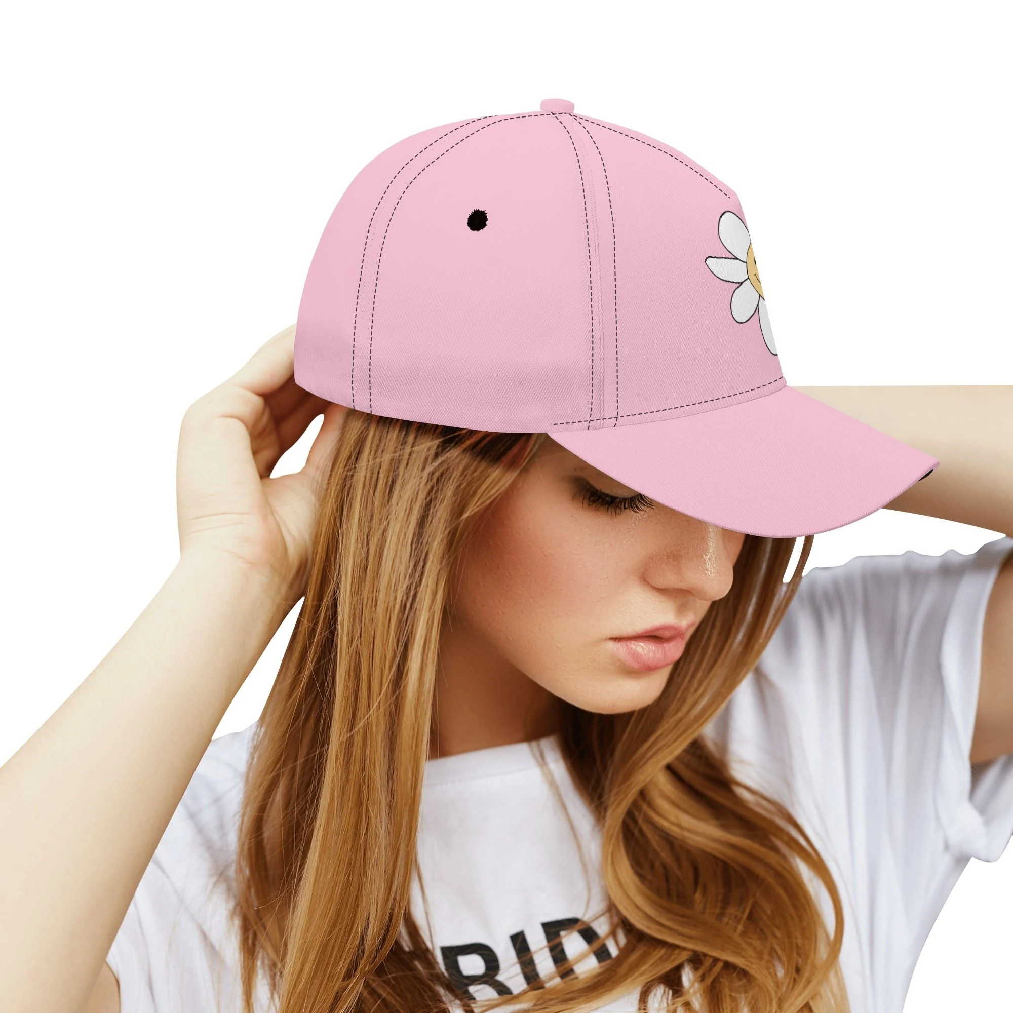 Gorra de béisbol blanca con estampado floral amarillo y cara sonriente en el centro. Visera precurvada y ajuste universal.