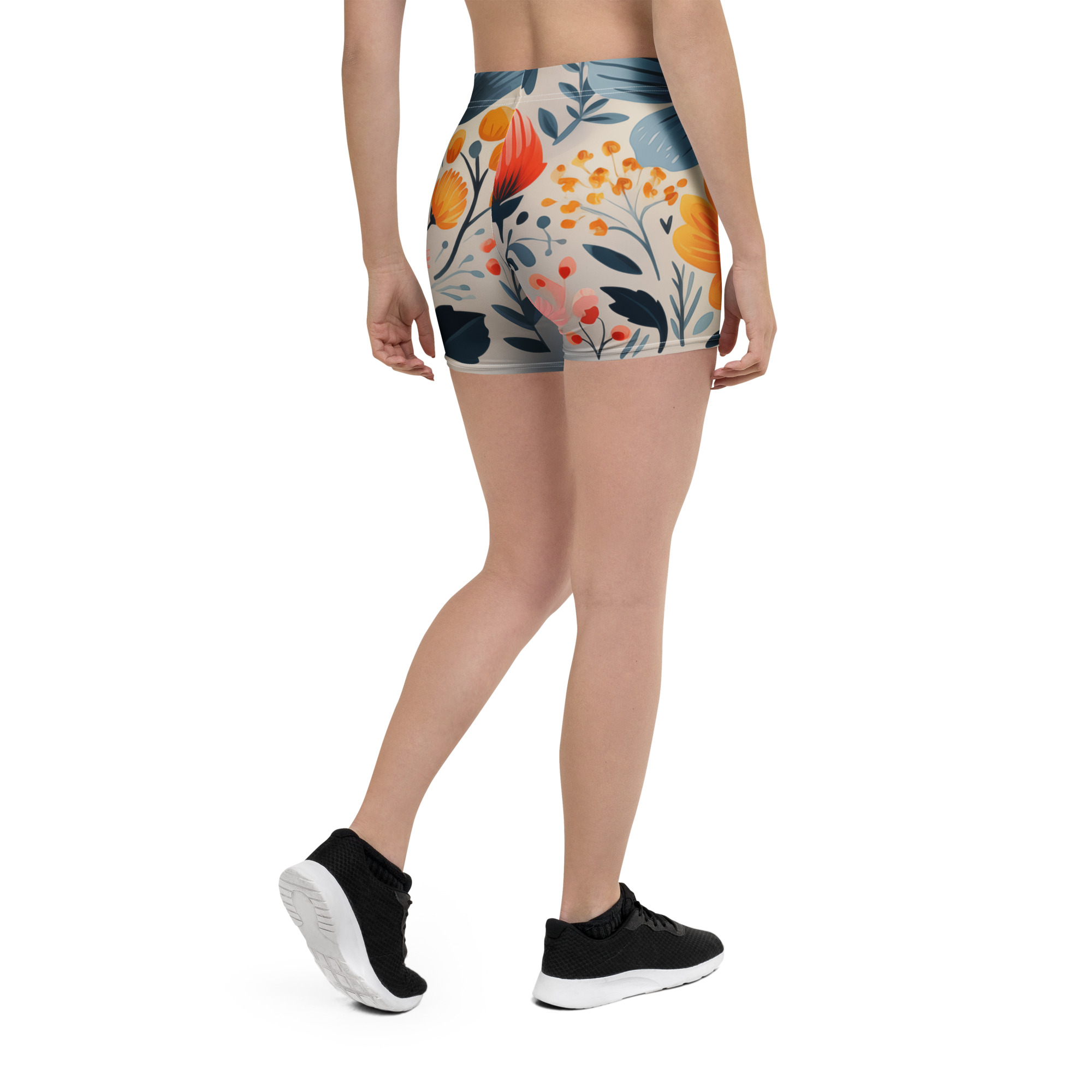Mockup frontal de mujer luciendo shorts deportivos con estampado floral escandinavo vibrante.