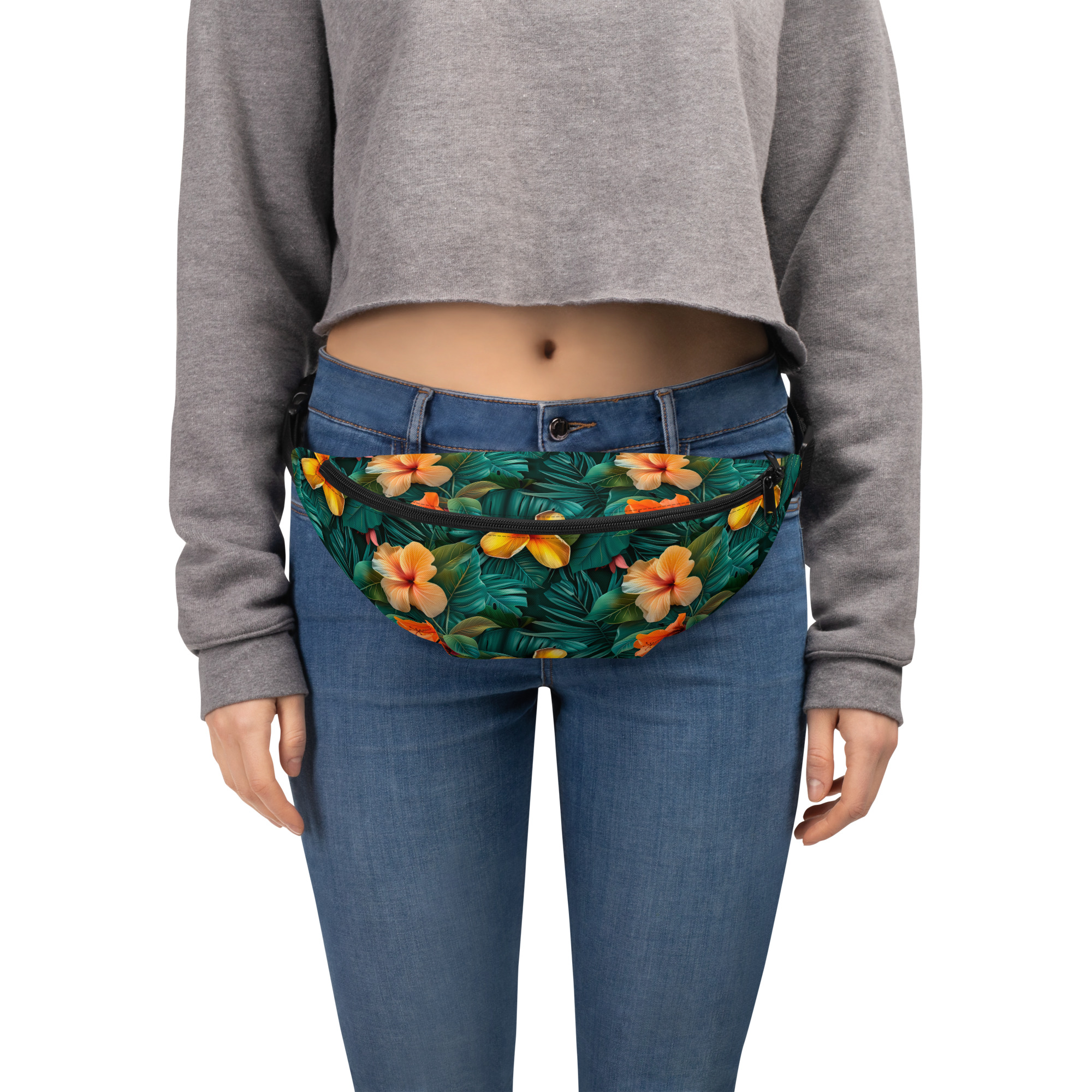 Riñonera floral tropical con estampado integral de hibiscos naranjas sobre fondo verde – colección Tropic Heat.